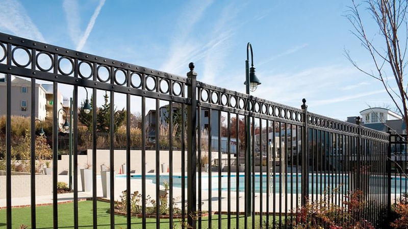 Ornamental iron fencing adds an upscale look to any commercial property